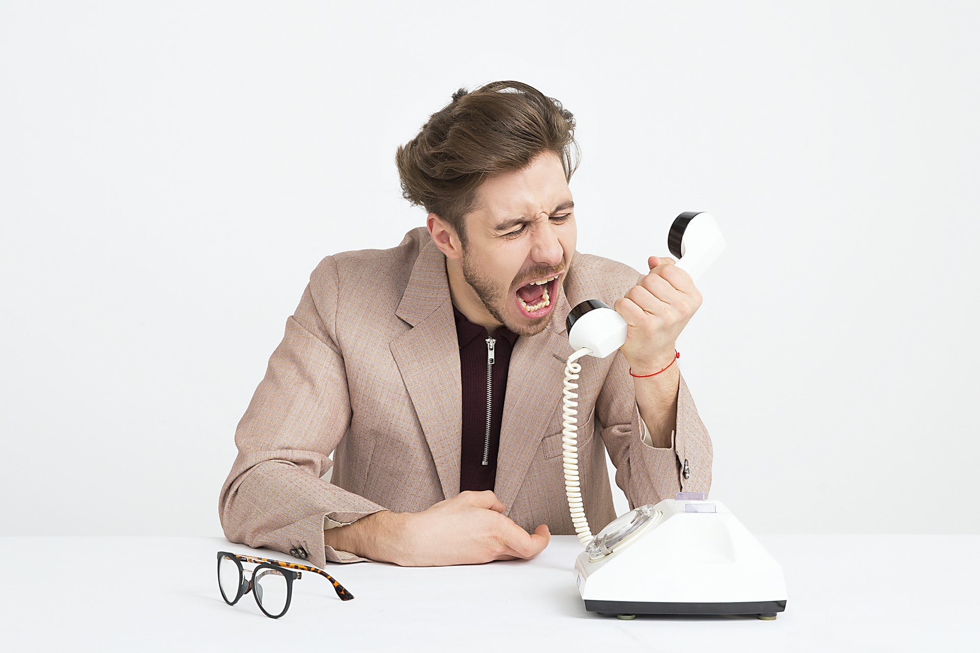 Man yelling at the phone